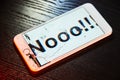 Image of smartphone with broken screen and the word Nooo!!! on it Royalty Free Stock Photo