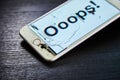 Image of smartphone with broken screen and the word Ooops! on it Royalty Free Stock Photo