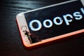 Image of smartphone with broken screen and the word Ooops! on it Royalty Free Stock Photo