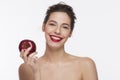 Image of a smile beautiful girl with an red apple Royalty Free Stock Photo