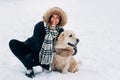 Image of smiling woman with dog in winter park Royalty Free Stock Photo