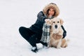 Image of smiling woman with labrador in winter park Royalty Free Stock Photo