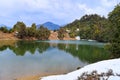 Deoria or Deoriya Tal Lake with Lush Green Trees and Snow - Winter Himalayan Landscape, Uttarakhand, India