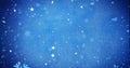 Image of snow flakes falling on blue background Royalty Free Stock Photo
