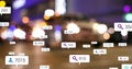 Image of social media icons and numbers on banners over out of focus traffic in city Royalty Free Stock Photo