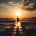 image of a solitary figure standing at the end of the jetty, the sun\'s last rays of light illuminating the distant horizon. Royalty Free Stock Photo