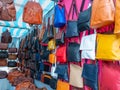 Bags of various colours and types in a flea market Royalty Free Stock Photo