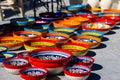 image of some colored pots and plates from a street market