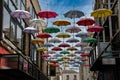 an image of some colorful umbrellas suspended in the air