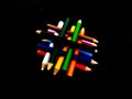 Some colorful wooden pencil isolated on black background