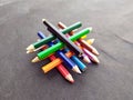 Some colorful wooden pencil isolated on black background