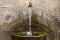 Source of drinking water in the stone close up