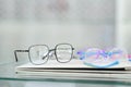 Image of spectacles of different shapes on table in optical store. Optics, health care and vision concept