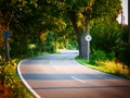 Image of speed limit of 30 kmh next to a curvy road