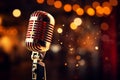 Image Spotlight on a retro microphone on stage with bokeh background Royalty Free Stock Photo