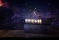 image of stack of antique books over wooden table and dark background.