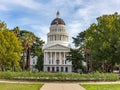 A image of the State Capitol Building in Sacramento, California on a beautiful day with a blue sky and green trees surrounding the Royalty Free Stock Photo