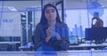 Image of statistical data and graphs, caucasian woman looking at camera and discussing in office