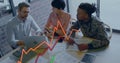 Image of statistical data processing against diverse colleagues discussing together at office Royalty Free Stock Photo