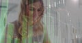 Image of statistics and data processing over woman using smartphone Royalty Free Stock Photo