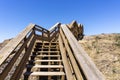 Steep wooden hallway stairs on the cliff