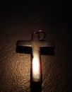 Cross made of stone on a leather background Royalty Free Stock Photo