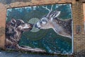 Image of street art, with wolf and deer facing off, Rochester, New York, 2017