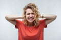 Image of stressed blonde girl grabbing her head. Problems, surprise, fear, fobia concept. Studio shot, white background