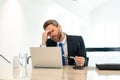 image of stressed business man has headache. stressed business man has headache in office. Royalty Free Stock Photo