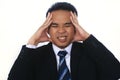 Image of stressed young asian businessman having problems and headache Royalty Free Stock Photo