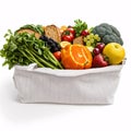 studio photograph of a brown grocery bag with fruits, vegetables, bread, bottled beverages, and isolated on a white ba Royalty Free Stock Photo