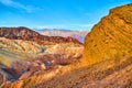 Stunning view by red rocks of Death Valley colorful layers in mountains Royalty Free Stock Photo