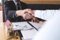 Image of successful deal of real estate, Broker and client shaking hands after signing contract approved application form, Royalty Free Stock Photo