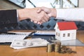 Image of successful deal of real estate, Broker and client shaking hands after signing contract approved application form, Royalty Free Stock Photo