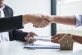 Image of successful deal of real estate, Broker and client shaking hands after signing contract approved application form, Royalty Free Stock Photo