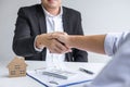 Image of successful deal of real estate, Broker and client shaking hands after signing contract approved application form, Royalty Free Stock Photo