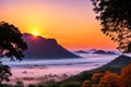 Sunrise over the moutain in Kanchanaburi, western provinve of Thailand, with silhouette trees in the