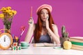 Image of surprised teenage girl studying with exercise books while sitting at desk Royalty Free Stock Photo