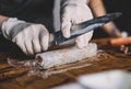 Image of a sushi master preparing a california roll Royalty Free Stock Photo