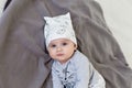 Image of sweet baby girl in a cute hat, closeup portrait of cute 6 month old smiling girl, toddler. Royalty Free Stock Photo