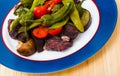 Image of tasty lamb stewed with different vegetables served at plate