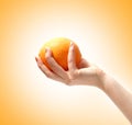 Image of a tasty orange in a human hand
