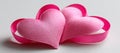 Image technology displays pink ribbon tape arranged into a heart Royalty Free Stock Photo