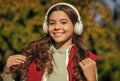 image of teen girl listening music. teen girl listening music outdoor. teen girl listening music Royalty Free Stock Photo