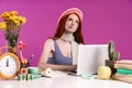 Image of thoughtful teen girl studying on laptop computer while sitting at desk Royalty Free Stock Photo