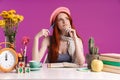 Image of thoughtful teenage girl studying with exercise books while sitting at desk Royalty Free Stock Photo