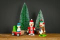 three Christmas figures reindeer Santa Claus toys