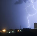 Image of thunder lightning against blue stormy sky with copy space
