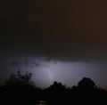 Image of thunder lightning against grey stormy sky with copy space