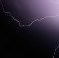 Image of thunder lightning against grey stormy sky with copy space